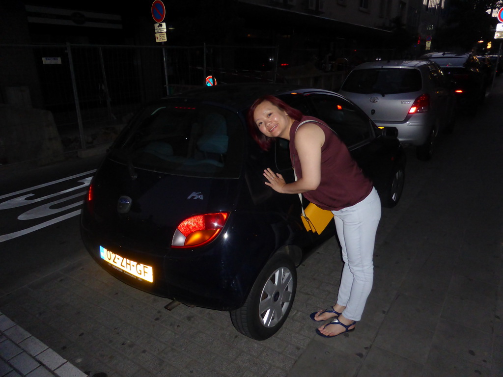 Miaomiao with our Ford Ka parked at the Rue Joseph Junk street, at sunset