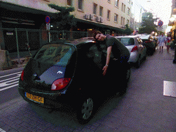 Tim with our Ford Ka parked at the Rue Joseph Junk street, at sunset