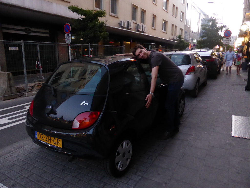 Tim with our Ford Ka parked at the Rue Joseph Junk street, at sunset