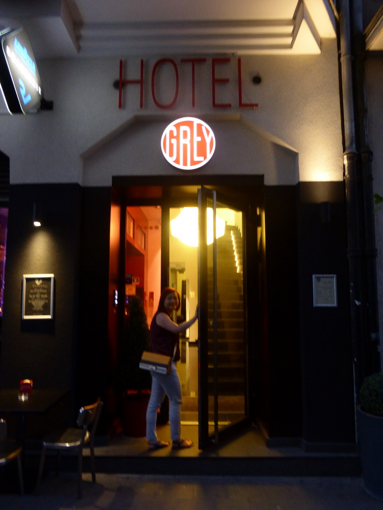 Miaomiao in front of Hotel Grey at the Rue Joseph Junk street, at sunset