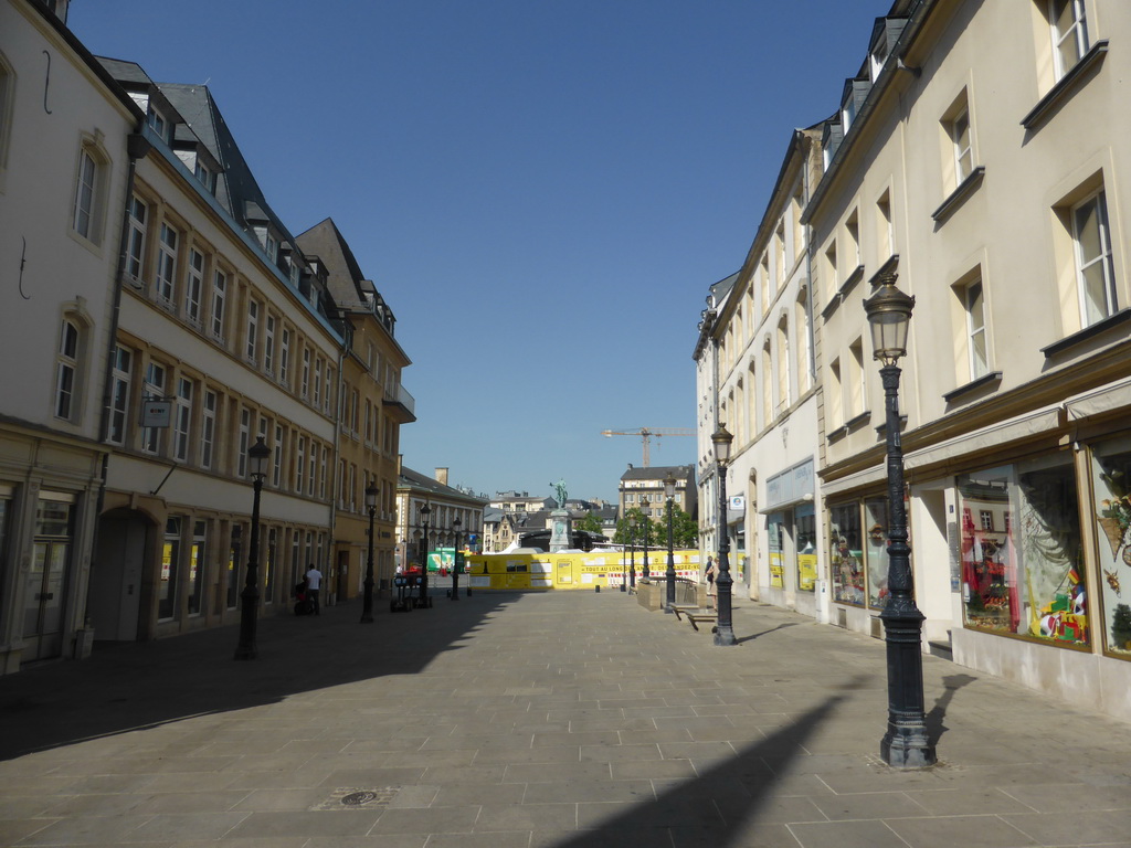 The Rue de la Reine street and the statue of King William II of the Netherlands at the Place Guillaume II square