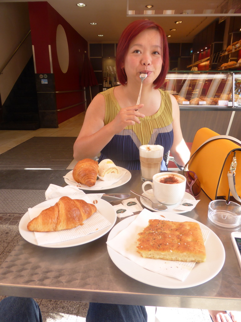 Miaomiao having breakfast at the Bakes Grand-Rue bakery at the Grand-Rue street