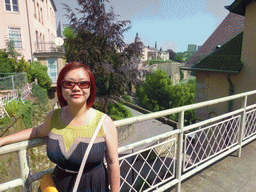 Miaomiao at the entrance to the State Archives building, with a view on the Chemin de la Corniche street and Saint Michael`s Church