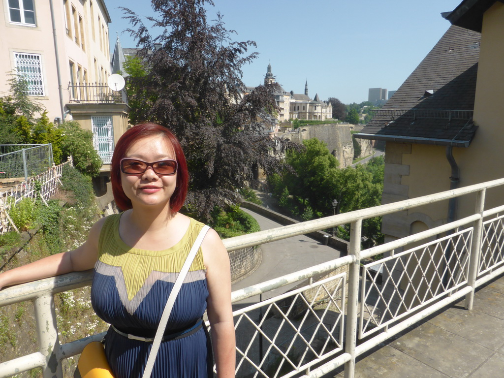 Miaomiao at the entrance to the State Archives building, with a view on the Chemin de la Corniche street and Saint Michael`s Church