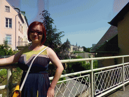 Miaomiao at the entrance to the State Archives building, with a view on the Chemin de la Corniche street and Saint Michael`s Church