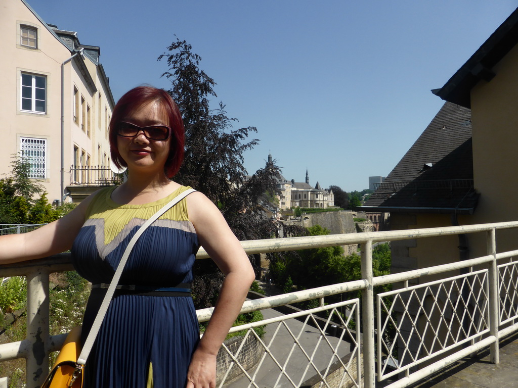 Miaomiao at the entrance to the State Archives building, with a view on the Chemin de la Corniche street and Saint Michael`s Church