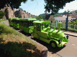 Tourist train at the Rue Sosthène Weis street and the Johanneskirche church