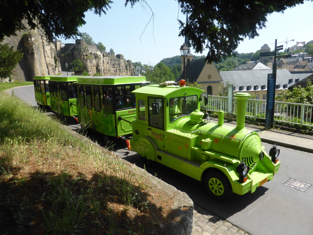 Tourist train at the Rue Sosthène Weis street and the Johanneskirche church