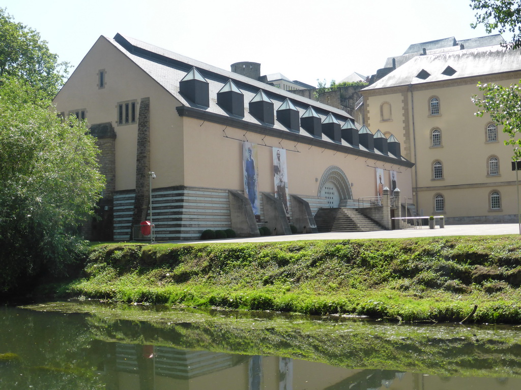 The Alzette-Uelzecht river and the northeast building of the Abbey of Neumünster