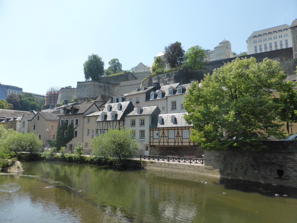 The Alzette-Uelzecht river, houses at the Grund district and the Chemin de la Corniche street, viewed from the Rue Münster bridge