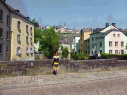 Miaomiao at the Rue Münster bridge, with a view on the Alzette-Uelzecht river, houses at the Grund district, the Casemates du Bock and Saint Michael`s Church