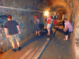 Tourists in a tunnel with loopholes at the Bastion side of the Casemates de la Pétrusse