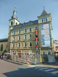 Tower of Saint Michael`s Church and the adjacent building at the Rue Sigefroi street