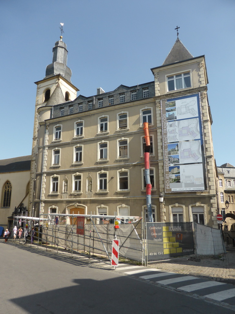 Tower of Saint Michael`s Church and the adjacent building at the Rue Sigefroi street