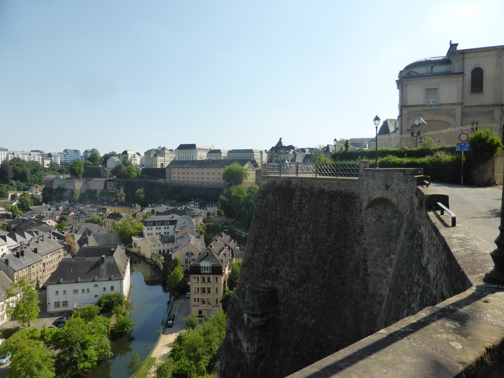 The Grund district with the Alzette-Uelzecht river and the State Archives building, viewed from the northeast end of the Chemin de la Corniche street