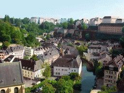 The Grund district with the Alzette-Uelzecht river and the State Archives building, viewed from the northeast end of the Chemin de la Corniche street