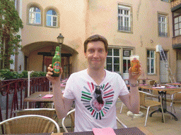 Tim with Tsingtao beer at the Ming Dynasty restaurant at the Grand-Rue street