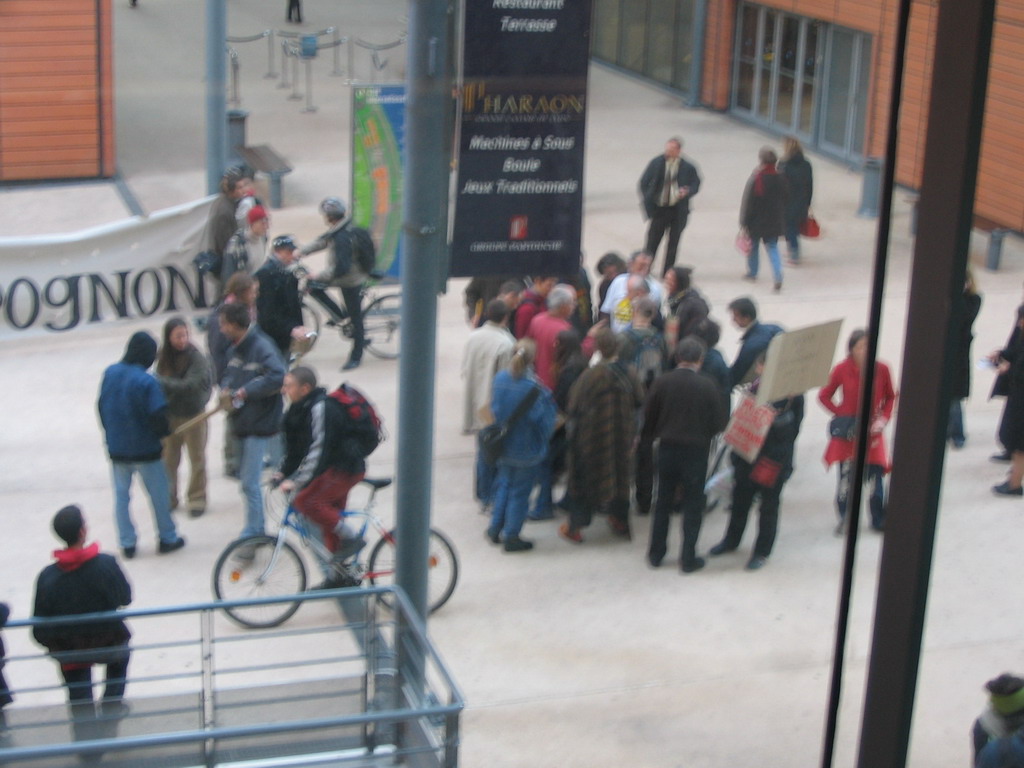 Demonstrators in front of the entrance to the Centre Congrès de Lyon conference center