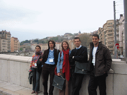 Friends at the Pont de la Feuillée bridge over the Saône river, with a view on the Passerelle Saint-Vincent pedestrian bridge