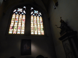 Stained glass windows and a statue in the right transept of the Sint-Servaasbasiliek church