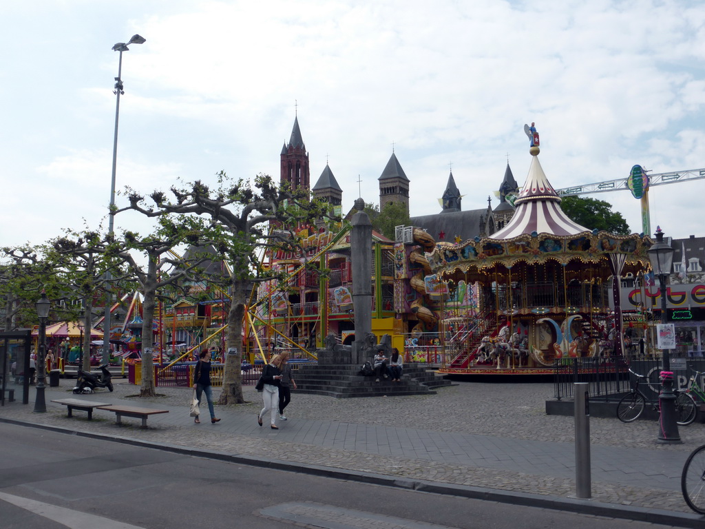 Funfair attractions at the Vrijthof square, and the towers of the Sint-Janskerk church and the Sint-Servaasbasiliek church