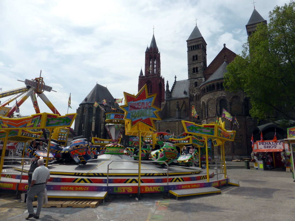Funfair attractions at the Vrijthof square, and the towers of the Sint-Janskerk church and the Sint-Servaasbasiliek church