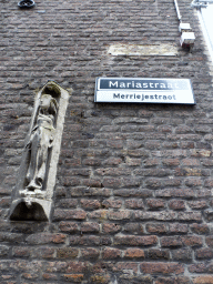 Relief and street sign in Dutch and Limburgic at the Mariastraat street