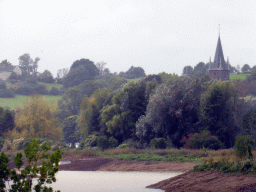 The Maas river and the tower of the Kerk van Sint-Pieter boven church, viewed from the Limburglaan street