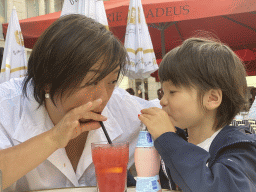 Miaomiao and Max having a drink on the terrace of the Brasserie Amadeus restaurant at the Dominicanerplein square