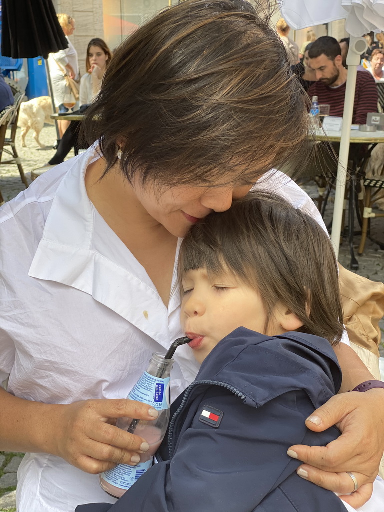 Miaomiao and Max having a drink on the terrace of the Brasserie Amadeus restaurant at the Dominicanerplein square