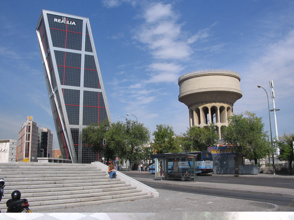 One of the Puerta de Europa towers and a water tower at the Plaza de Castilla square