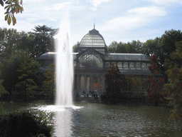 The Palacio de Cristal, with the fountain in the lake in front, in the Parque del Buen Retiro park