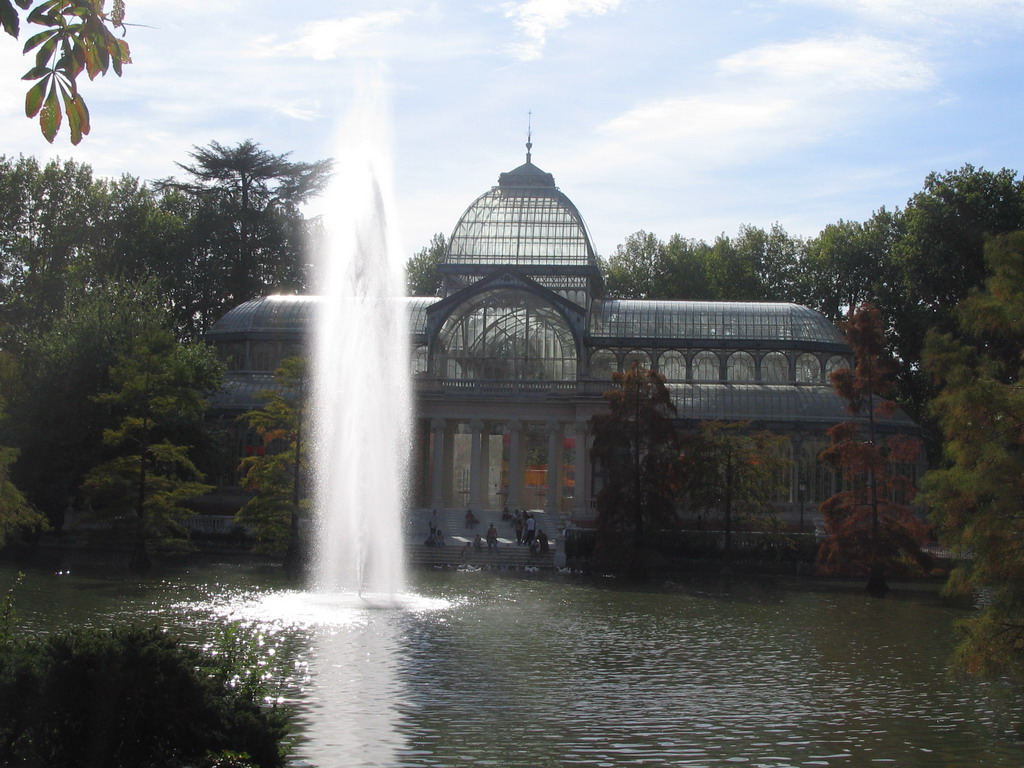 The Palacio de Cristal, with the fountain in the lake in front, in the Parque del Buen Retiro park