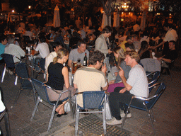 Terrace bar in the city center, by night