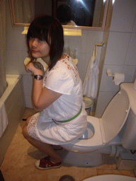 Miaomiao on the toilet of our room in the hotel `Euromadrid`