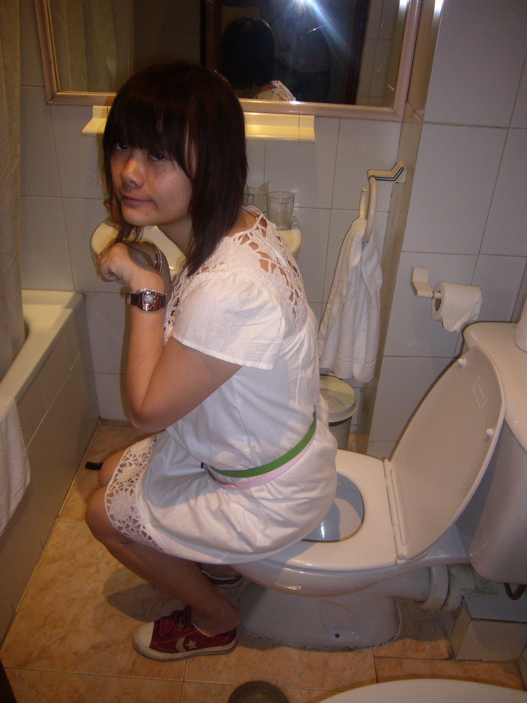 Miaomiao on the toilet of our room in the hotel `Euromadrid`