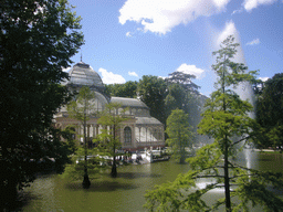 The Palacio de Cristal, with the fountain in the lake in front, in the Parque del Buen Retiro park