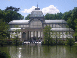 The Palacio de Cristal, with the lake in front, in the Parque del Buen Retiro park