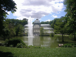 The Palacio de Cristal, with the fountain in the lake in front, in the Parque del Buen Retiro park