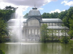 The Palacio de Cristal, with the fountain in the lake in front, in the Parque del Buen Retiro park