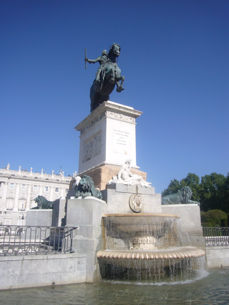 The equestrian statue of Philip IV at the Plaza de Oriente square, and the east side of the Royal Palace