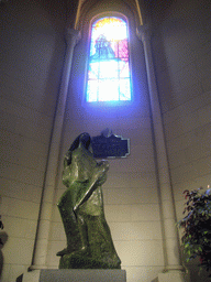 Statue and stained glass window in the Almudena Cathedral