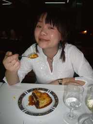 Miaomiao having dinner in a restaurant in the city center