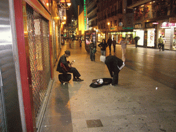 Miaomiao and a street musician in the Calle de Preciados shopping street