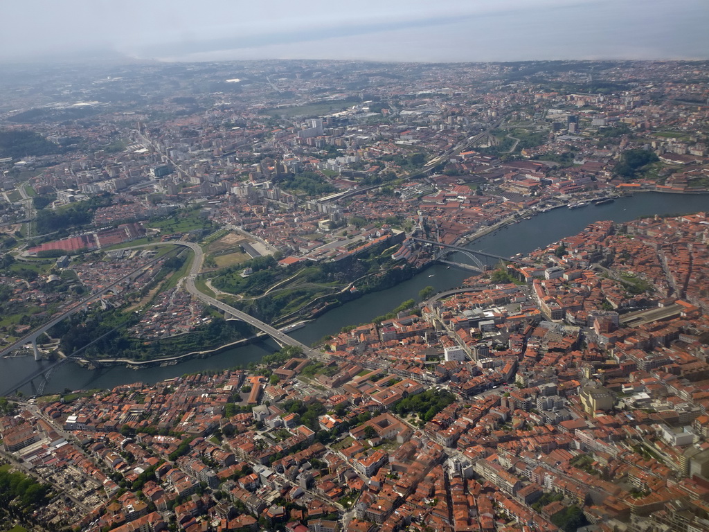 The cities of Porto and Vila Nova de Gaia with the Ponte de São João, Ponte de Dona Maria Pia, Ponte Infante Dom Henrique and Ponte Luís I bridges over the Douro river, viewed from the airplane from Eindhoven