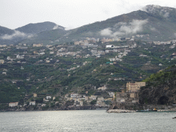 Building at the west side of town and the town of Minori, viewed from a parking lot next to the Amalfi Drive on the east side of town