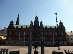 Fountain statue and Malmö Town Hall at Stortorget square, and the tower of Sankt Petri Kyrka church