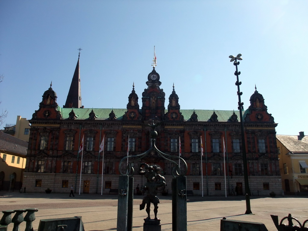 Fountain statue and Malmö Town Hall at Stortorget square, and the tower of Sankt Petri Kyrka church