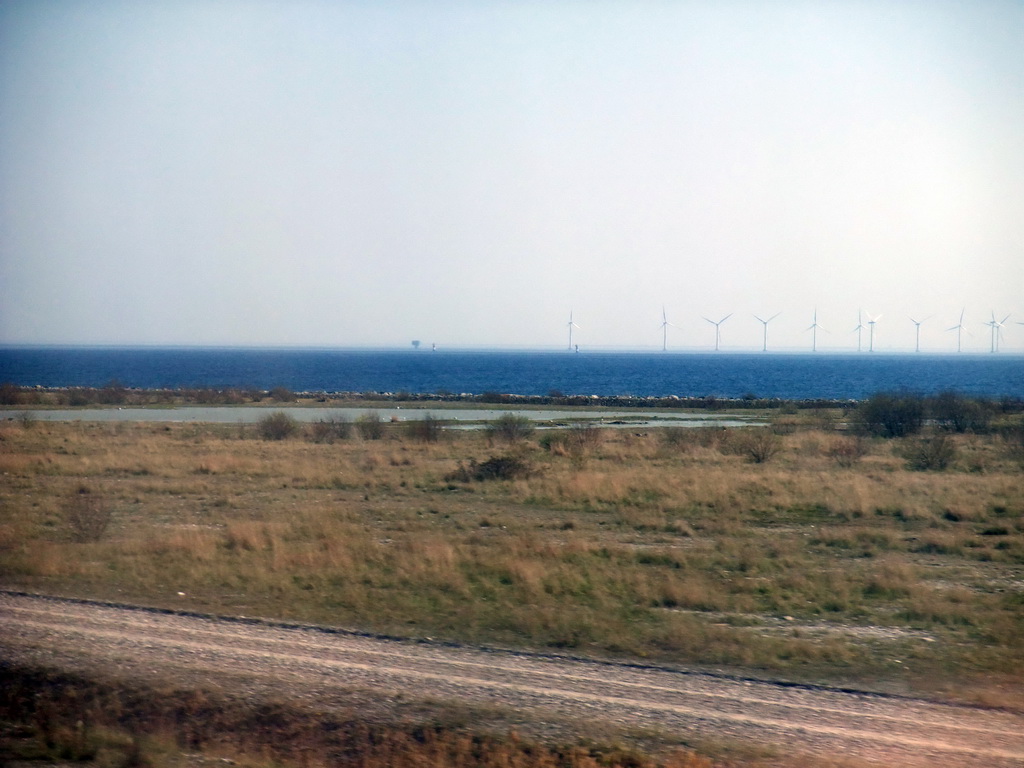 Peberholm island and windmills at the south side of the Öresund Bridge, viewed from the train from Malmö to Copenhagen