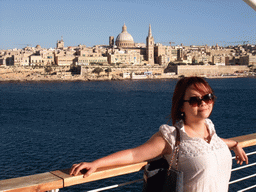 Miaomiao at Tigné Point with a view on Marsamxett Harbour and Valletta with the dome of the Carmelite Church and the tower of St Paul`s Pro-Cathedral